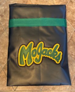 Picture of hockey bag folded up with the MoJacks logo printed on it.